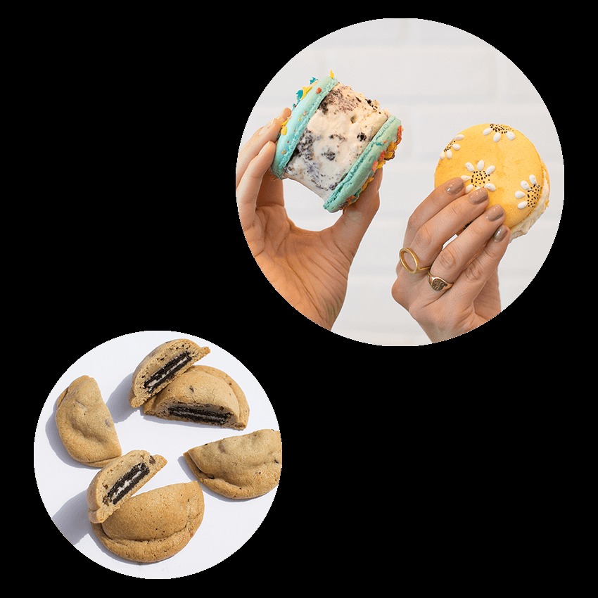Hands holding a giant macaron ice cream sandwich with a blue shell and cookies-and-cream filling, above chocolate chip cookies stuffed with Oreo halves